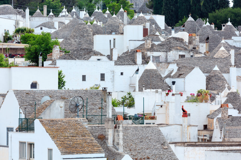 Trulli houses in main touristic district of Alberobello beautiful old historic town, Apulia region, Southern Italy
