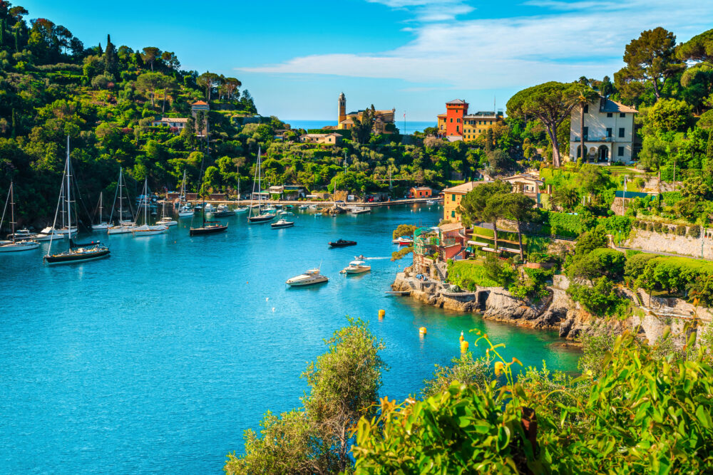 Wonderful bay with colorful mediterranean buildings and boats, yachts in spectacular vacation resort, Portofino, Liguria, Italy, Europe