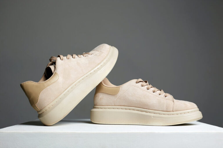 beige sneakers. fashion shoes still life. stylish photo in the studio